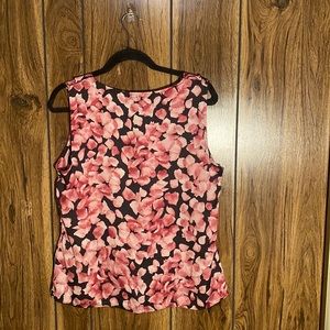 This blouse has ruffles in front